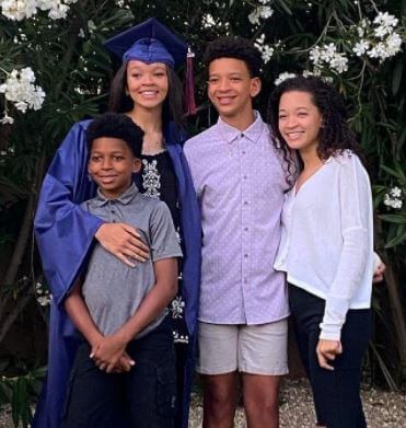 Janna Williams with her sister Faith and brothers Elijah and Micah during her high school graduation in 2020.